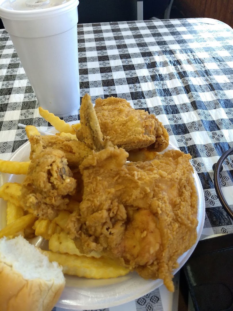 Fried chicken with classic sides on a plate.